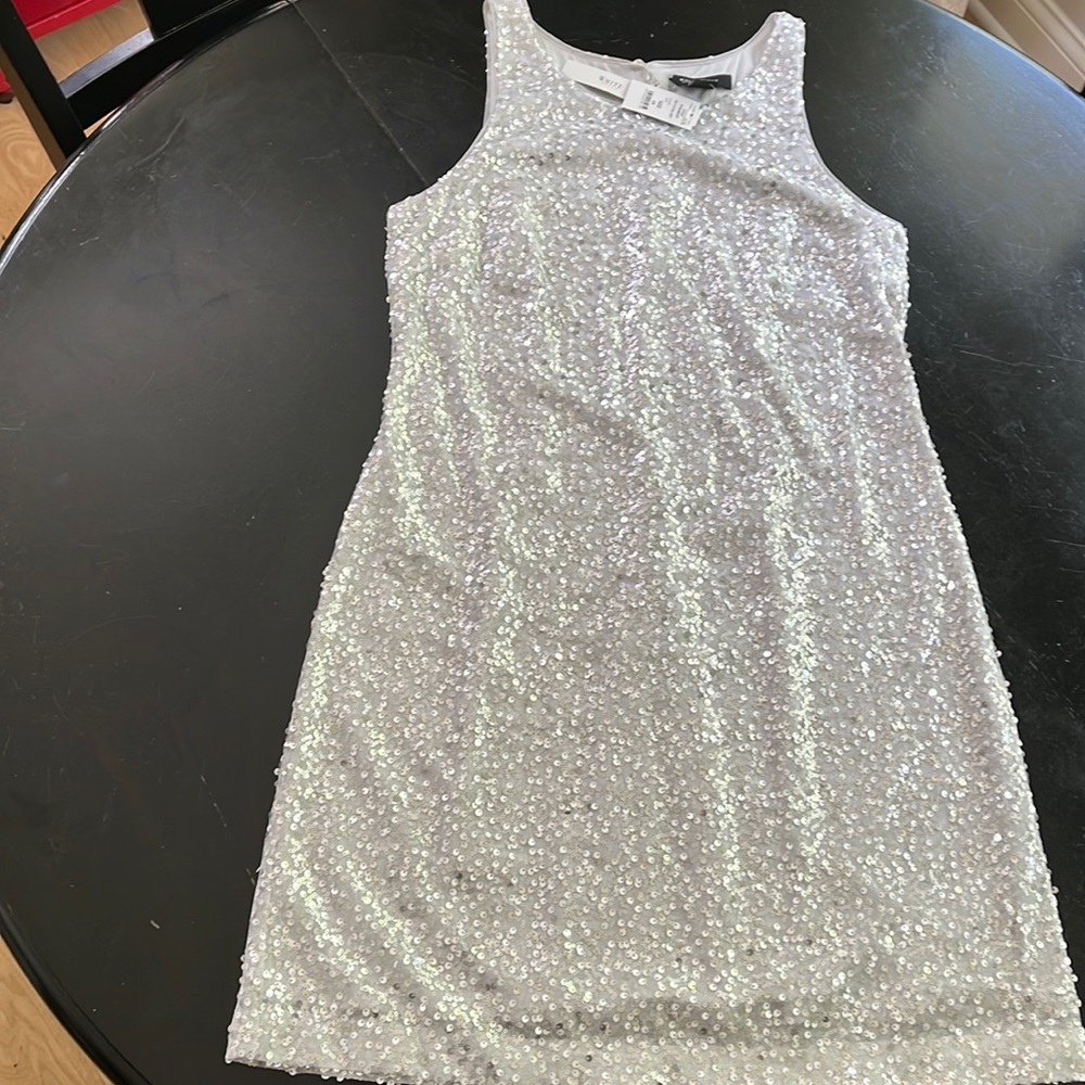 WHBM silver sleeveless dress. NWT. Gray lining with silver sequins.Size 10.